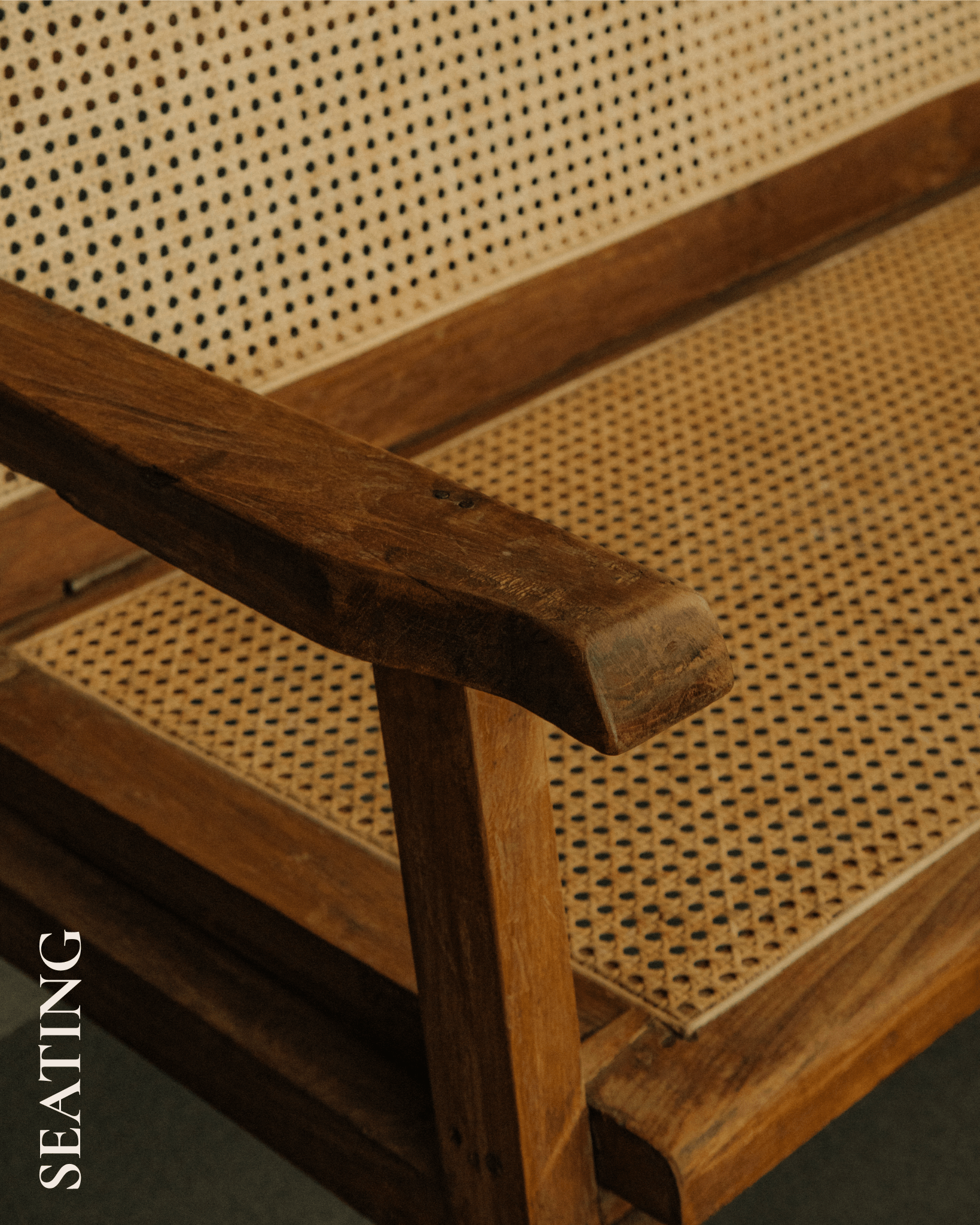 Detail of a vintage teak and rattan chair.