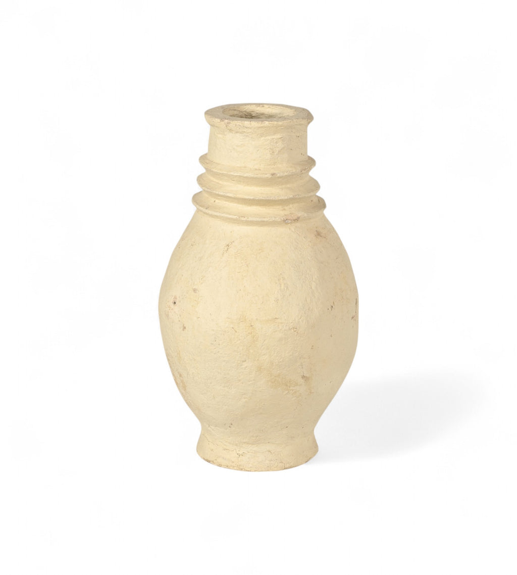 A handcrafted beige papier mache planter with a smooth finish.
