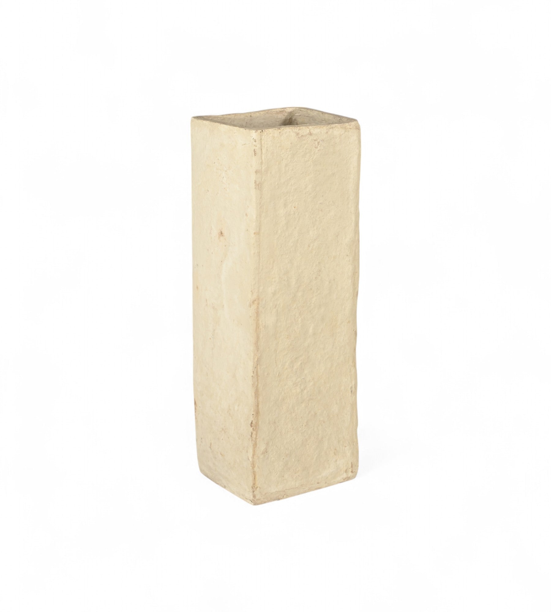 A beige papier mache planter with a minimalist and slender design, hand moulded in India, suitable for holding plants or dried flowers.