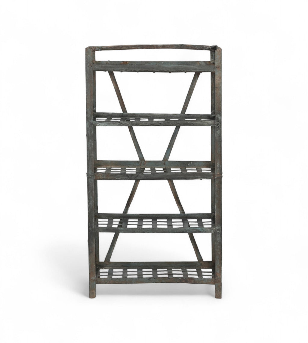 A vintage iron rack with five shelves featuring a blue grey patina and lattice style type shelves.