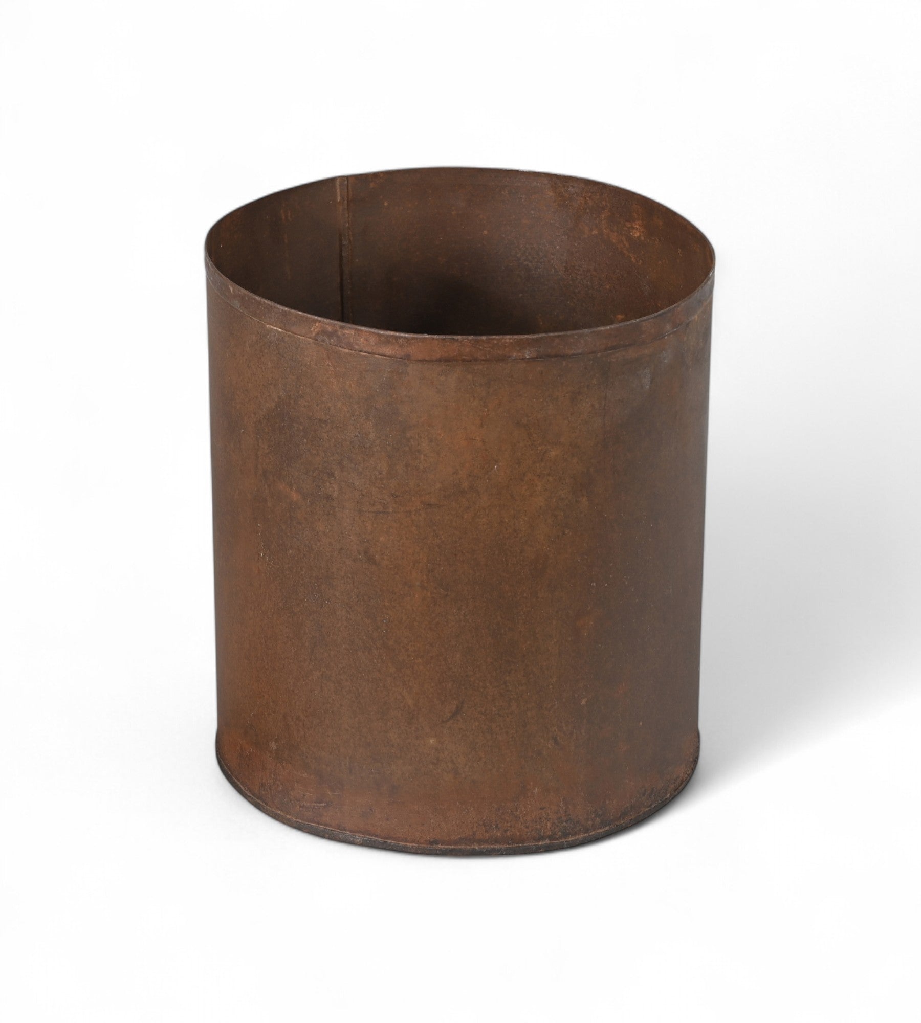 A vintage iron pot with a matte brown finish, cylindrical in shape, suitable for use as a bathroom bin, umbrella stand, or planter.