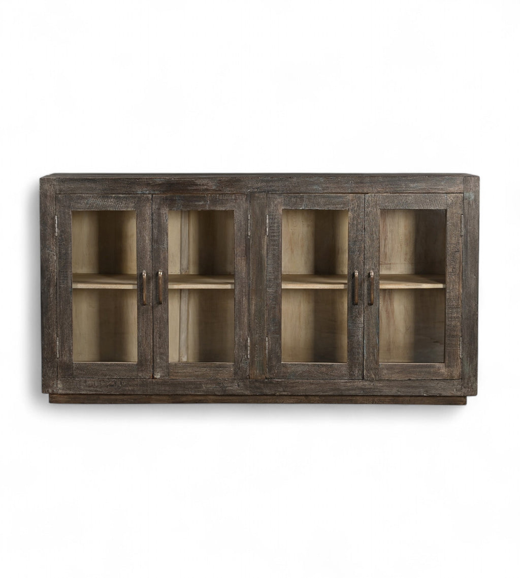 A mango wood sideboard with four glass fronted doors and a black and lime wash finish.