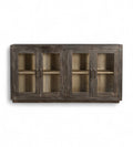A mango wood sideboard with four glass fronted doors and a black and lime wash finish.