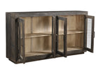 A mango wood sideboard with four glass fronted doors and a black and lime wash finish.