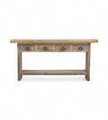 A rectangular recycled wood console table with four top drawers and a long bottom shelf, featuring a natural wood finish.