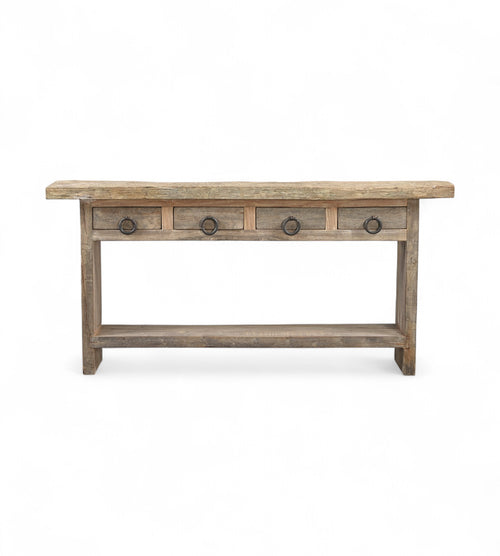 A rectangular recycled wood console table with four top drawers and a long bottom shelf, featuring a natural wood finish.
