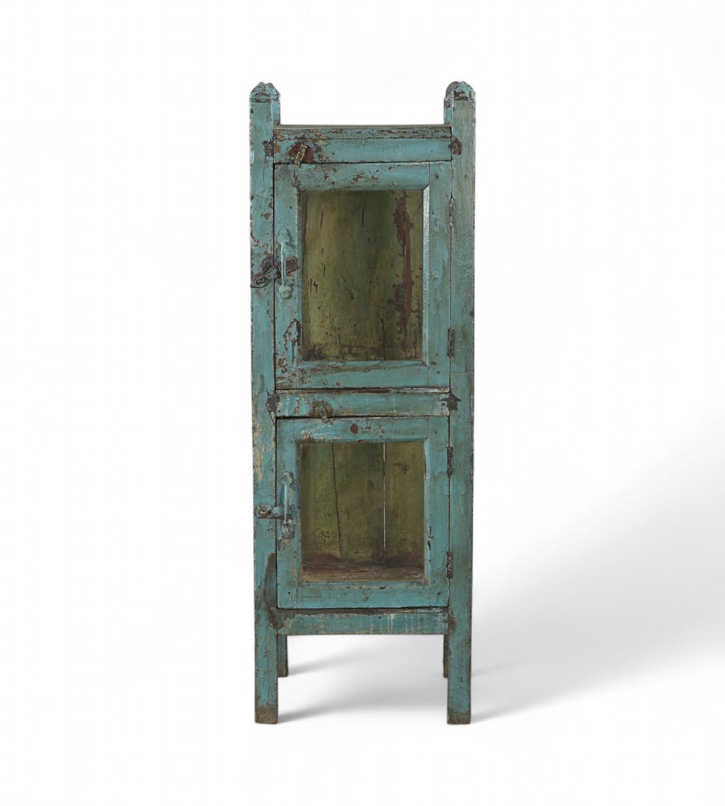 A vintage reclaimed wood glass display side cabinet with an aged turquoise finish and hints of soft green and faded yellow.