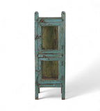 A vintage reclaimed wood glass display side cabinet with an aged turquoise finish and hints of soft green and faded yellow.