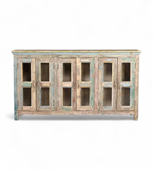 A recycled wood sideboard with glass panels on the doors and a multicolor finish.