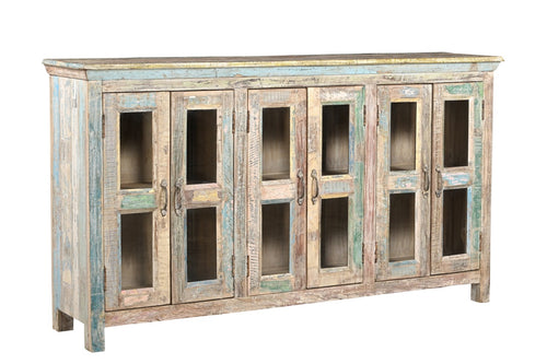 A recycled wood sideboard with glass panels on the doors and a multicolor finish.