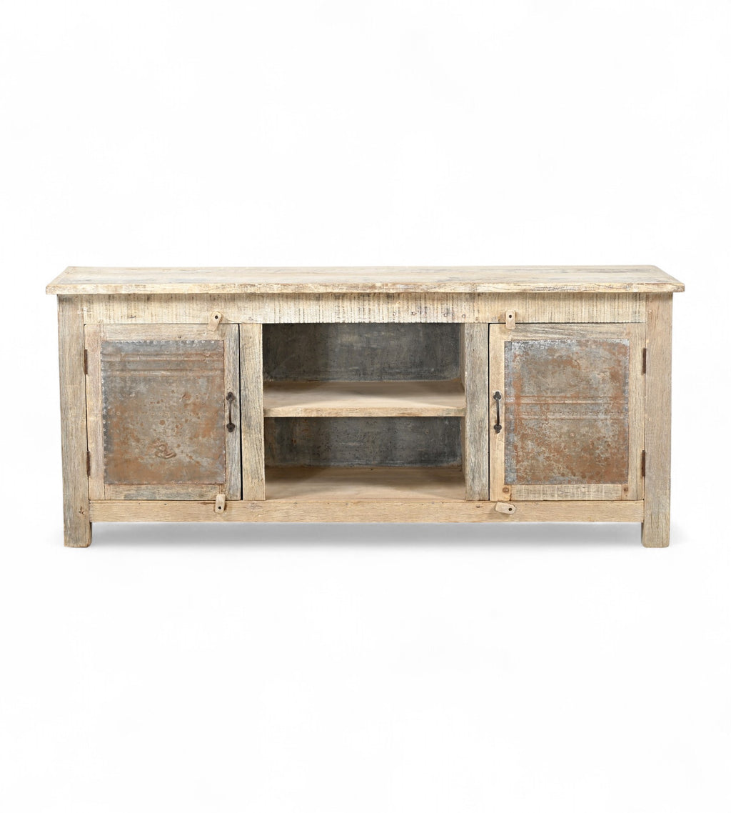 A sideboard made of Indian recycled wood with iron sheets on the doors, featuring internal compartments and a shelf.