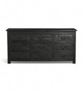 A vintage black teak wood 9-drawer chest of drawers with iron sheets pasted over the front.