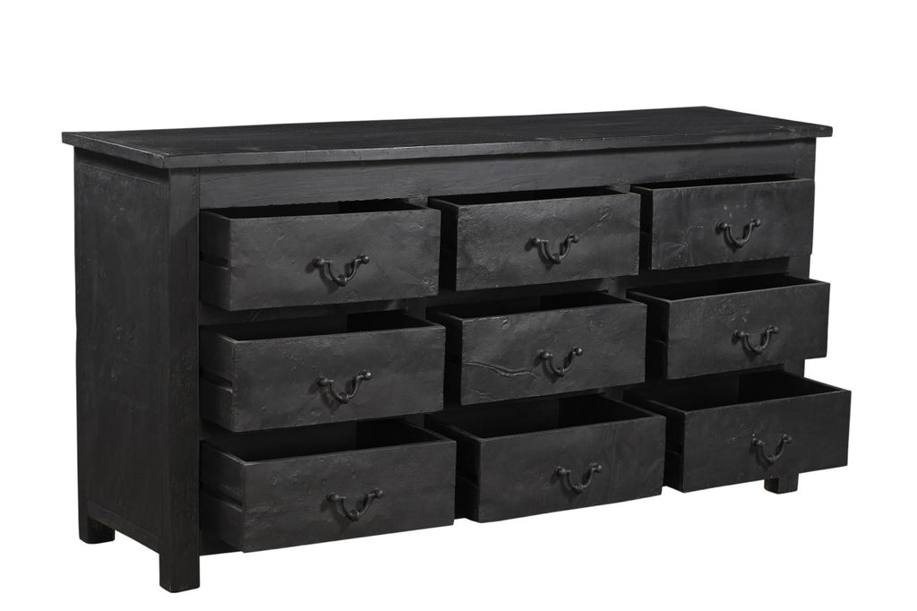 A vintage black teak wood 9-drawer chest of drawers with iron sheets pasted over the front.