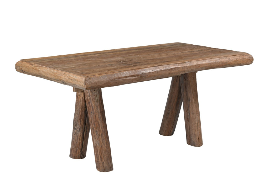 A rectangular kitchen dining table made of old solid reclaimed wood with thick cylindrical legs.