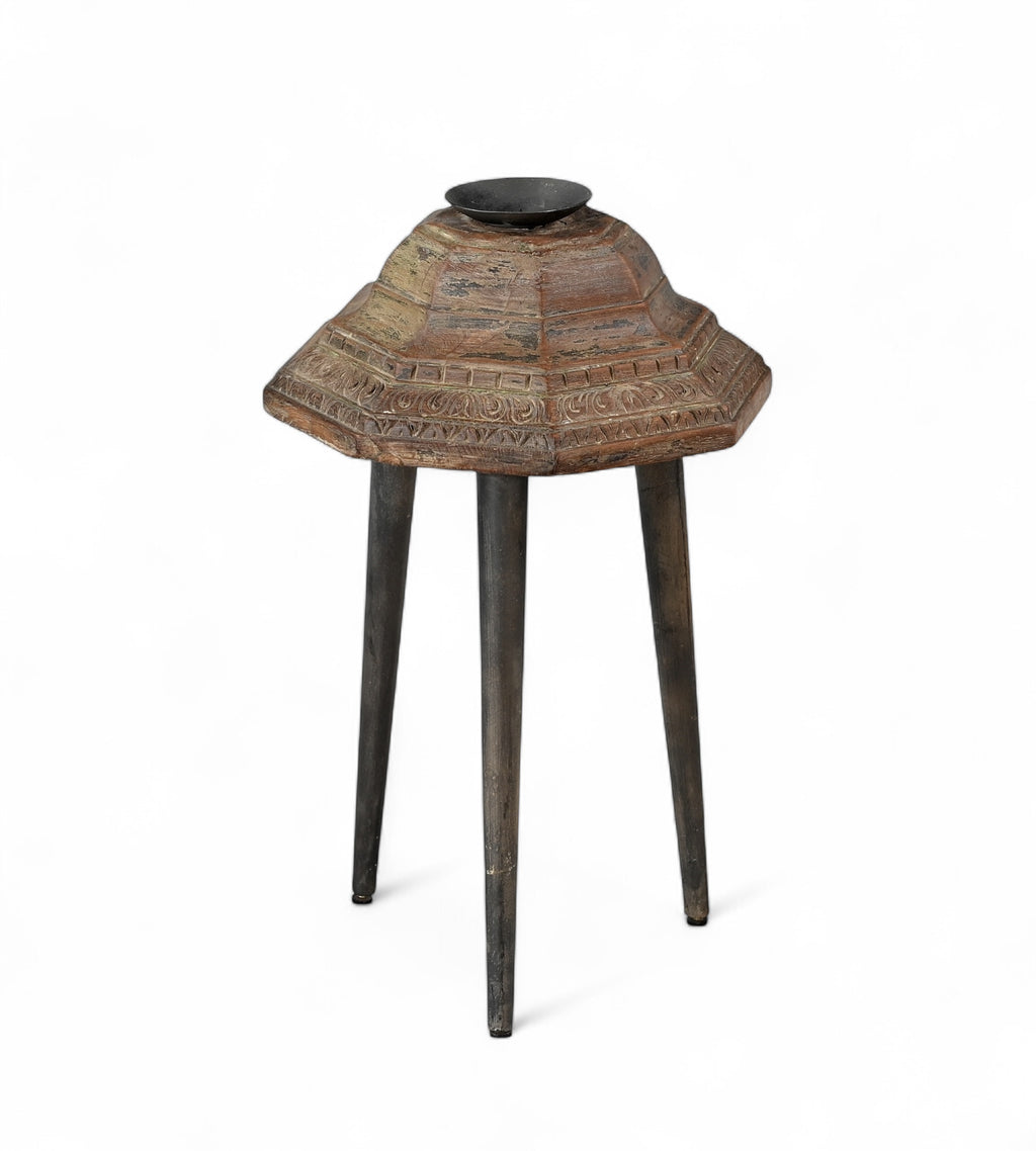 Carved teak candle holders on top of 3 legs