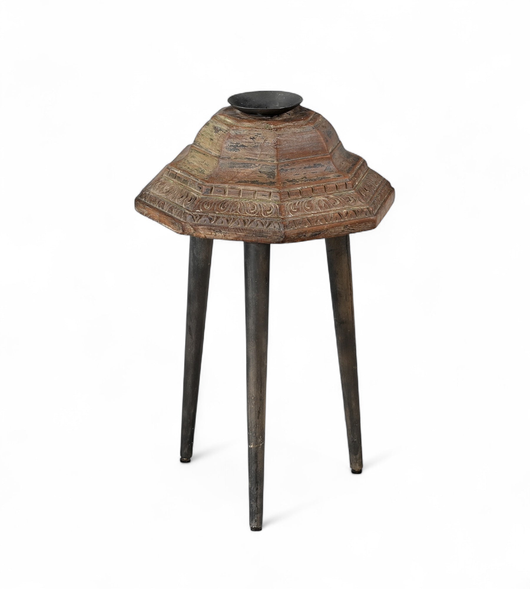 Carved teak candle holders on top of 3 legs