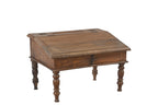 A vintage teak wood desk with a visible wood grain pattern and carved legs, with a closed hinged lid.