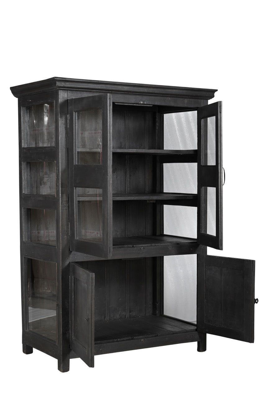 A vintage teak and glass display cabinet with black finish, featuring glass panelled upper doors and teak lower doors with an iron latch.