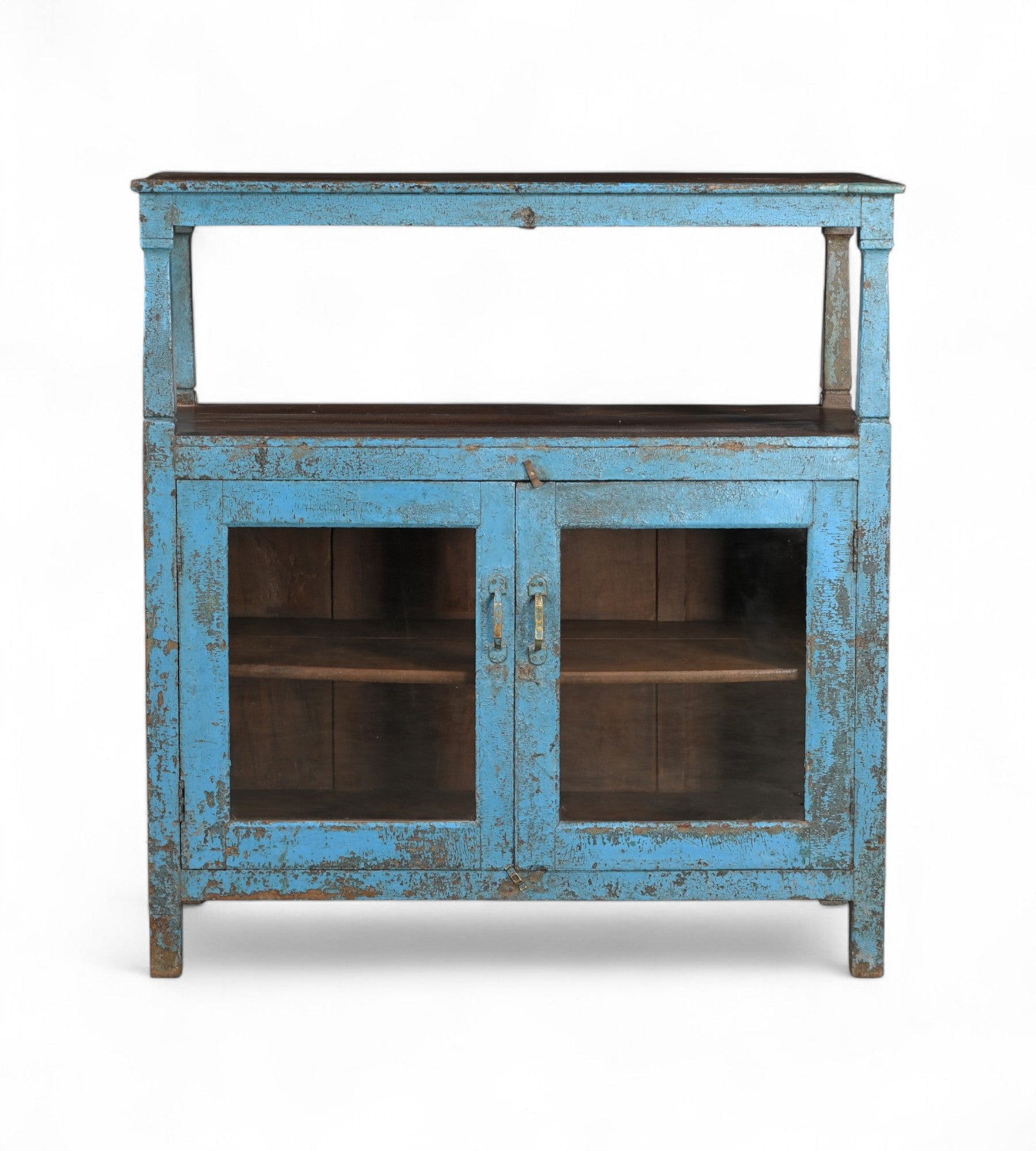 A vintage teak wood and glass cabinet with blue paint and patina, featuring a top shelf and double doors.