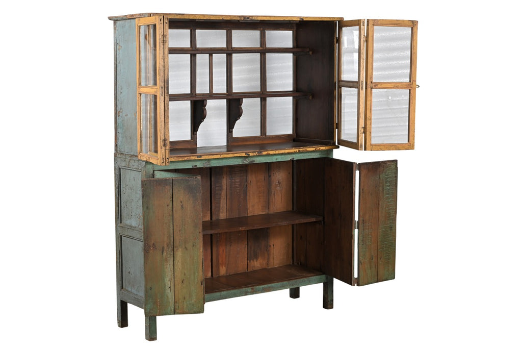 Wooden cabinet with glass panels with a green and yellow patina