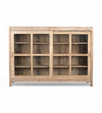 A vintage teak wood glass display cabinet with two doors and a flat top, featuring a warm brown finish.