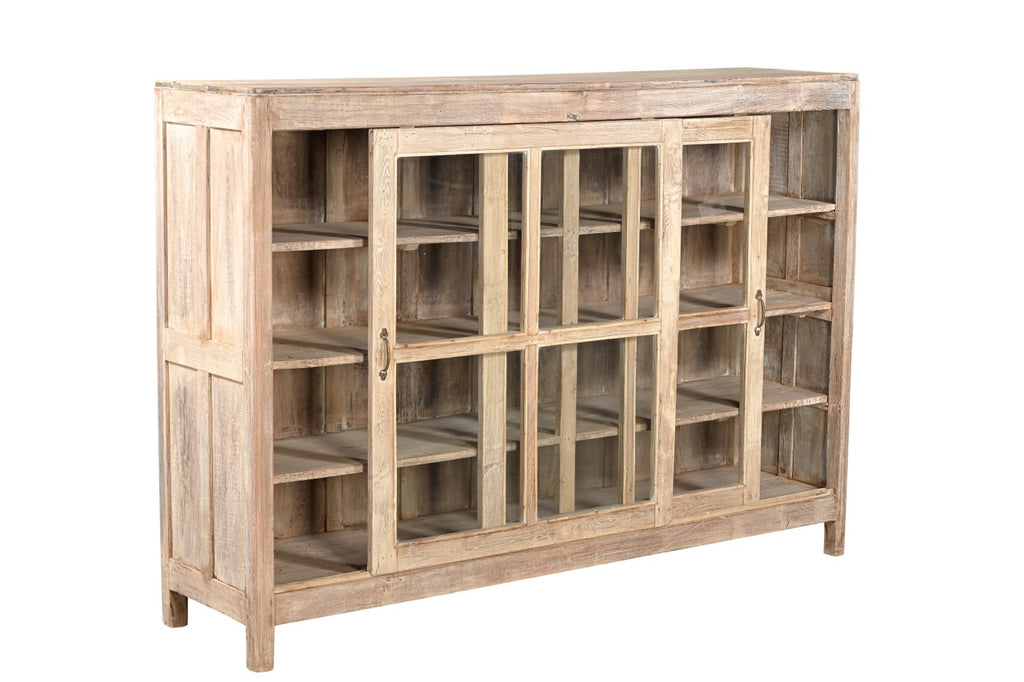 A vintage teak wood glass display cabinet with two doors and a flat top, featuring a warm brown finish