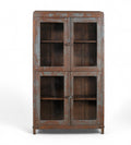 A vintage teak wood glass display cabinet with four glass doors and a visible wood patina of earthy brown and faded indigo.