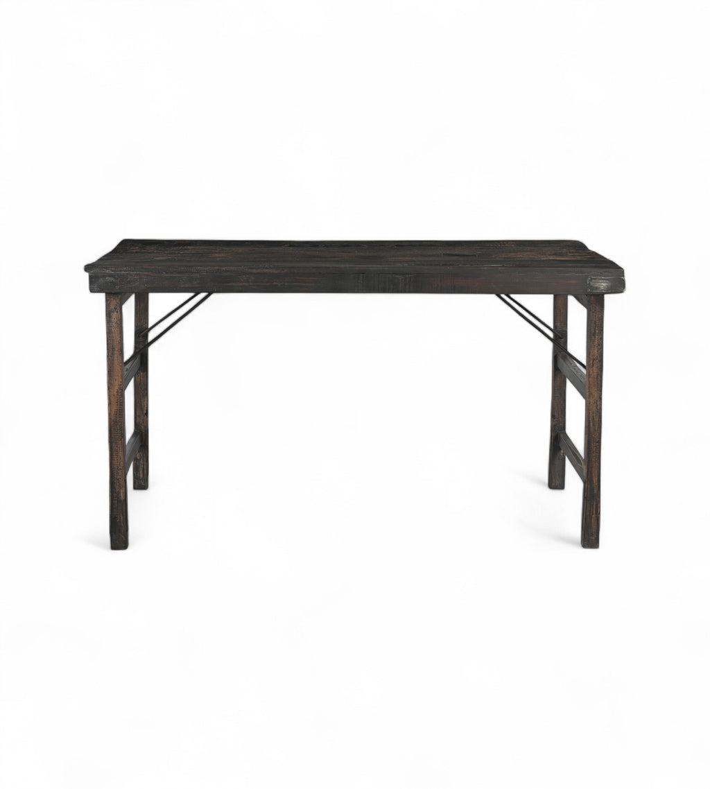 A vintage folding table made of solid teak wood with a dark finish, featuring a foldable design.