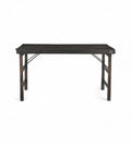A vintage folding table made of solid teak wood with a dark finish, featuring a foldable design.