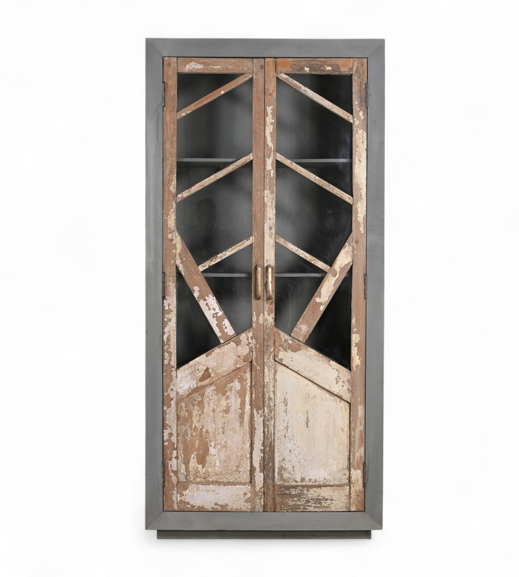 A vintage teak and reclaimed wood glass cabinet with a graphic door design and raw patina.