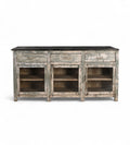 A vintage teak wood kitchen cabinet / kitchen island with glass panels on the cupboards, featuring a dark wood tabletop and an aged green and white patina finish.