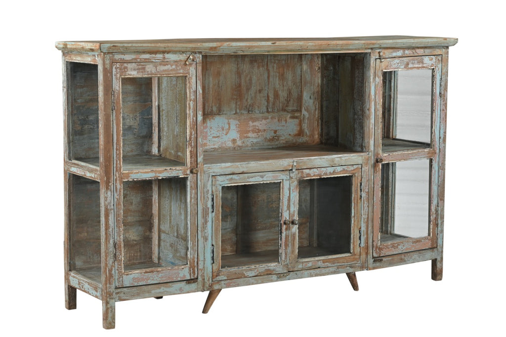 A vintage teak wood sideboard with glass doors and a distressed hand wash finish in earthy tones.