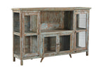 A vintage teak wood sideboard with glass doors and a distressed hand wash finish in earthy tones.