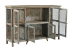 A vintage teak wood sideboard with glass doors and a distressed hand wash finish in earthy tones.