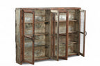 A vintage teak and recycled wood glass cabinet with a teal-grey finish on the back and sides.