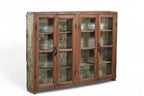 A vintage teak and recycled wood glass cabinet with a teal-grey finish on the back and sides.