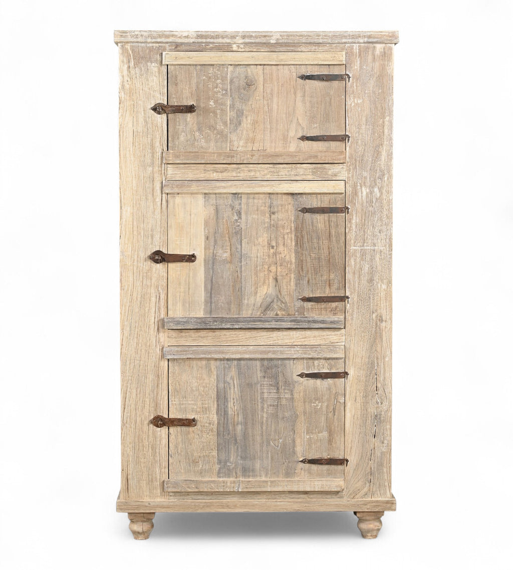 A wooden side cabinet with three panelled doors and rustic iron handles, with a sun finish highlighting the natural wood grain.