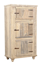 A wooden side cabinet with three panelled doors and rustic iron handles, with a sun finish highlighting the natural wood grain.