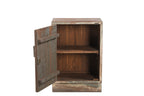 A vintage teak wood bedside table with a worn blue paint finish