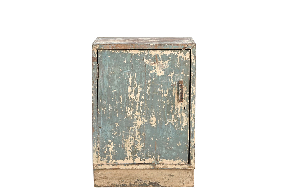 A vintage teak wood bedside table with a worn blue paint finish