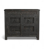 A vintage teak wood side cabinet with iron accents and a carved floral frieze, finished in black.