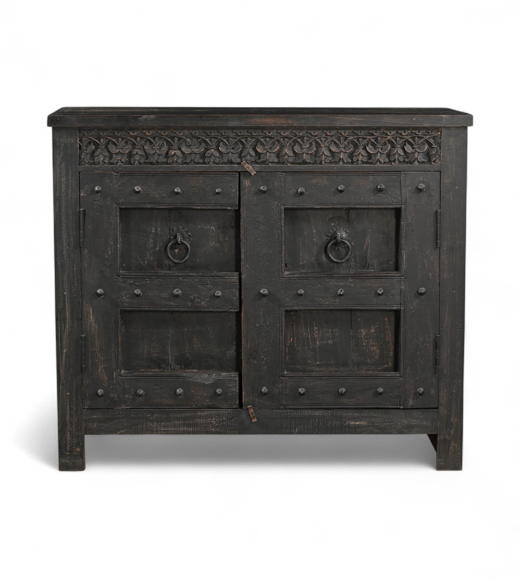 A vintage teak wood side cabinet with iron accents and a carved floral frieze, finished in black.