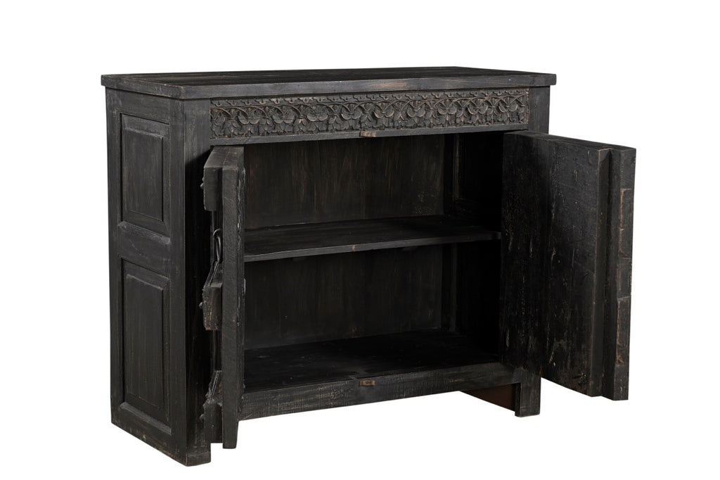 A vintage teak wood side cabinet with iron accents and a carved floral frieze, finished in black.