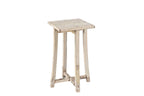 A vintage teak wood side table with subtly curved legs and a cross stretcher base, with a creamy white finish.
