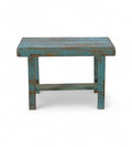 A rectangular vintage teak wood side table with a faded blue finish.