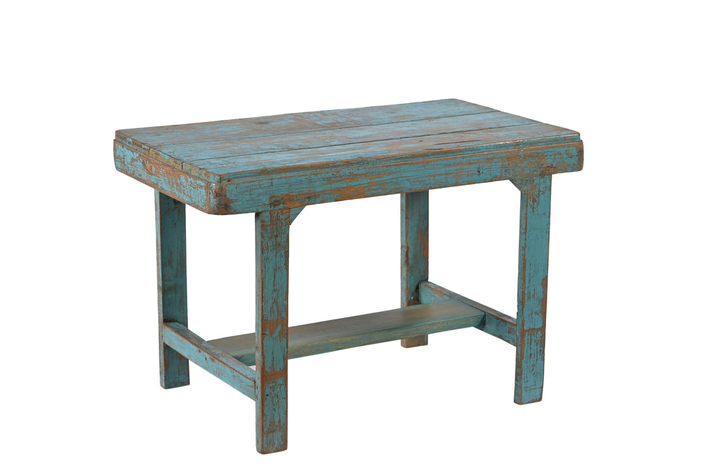 A rectangular vintage teak wood side table with a faded blue finish.