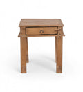 A tiny vintage teak wood side table with a visible drawer and a metal pull ring,