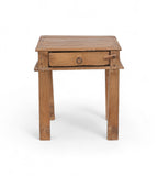 A tiny vintage teak wood side table with a visible drawer and a metal pull ring,
