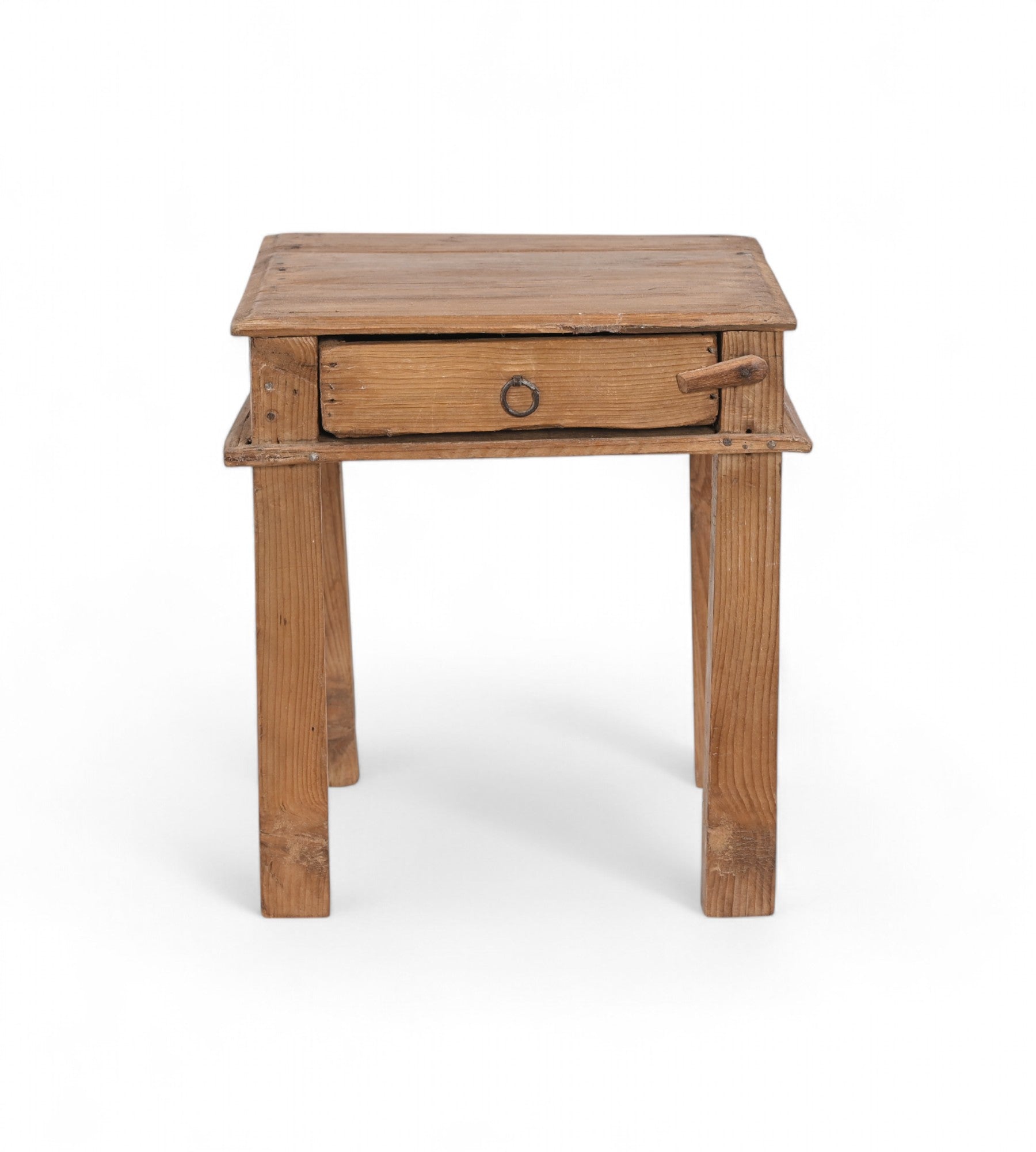 A tiny vintage teak wood side table with a visible drawer and a metal pull ring,