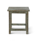 A vintage teak wood side table with a weathered green finish.